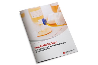 Laboratory technician pouring microbiological culture media into a Petri dish on a BIOSOLUTE microbiology brochure